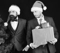 Managers with beards get ready for Christmas.