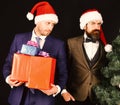 Managers with beards get ready for Christmas.