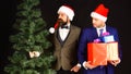 Managers with beards get ready for Christmas. Men in suits