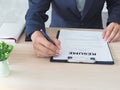 Managers are checking out the cover letter. By sitting on his desk. Resume concept