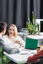 managers pointing at laptop with green Royalty Free Stock Photo