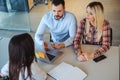 Managers talking seriously while interviewing female candidate Royalty Free Stock Photo