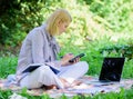 Managing business outdoors. Woman with laptop sit grass meadow. Business lady freelance work outdoors. Become successful