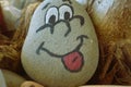 managing emotions emoji faces on stones - sad, happy, surprised worried and angry feelings draw