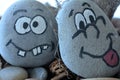 managing emotions emoji faces on stones - sad, happy, surprised worried and angry feelings draw .