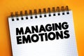 Managing Emotions text quote on notepad, concept background Royalty Free Stock Photo