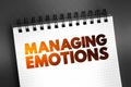 Managing Emotions text quote on notepad, concept background Royalty Free Stock Photo