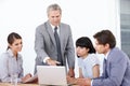 Managing his team to success. A business manager leading a strategy meeting at the office. Royalty Free Stock Photo