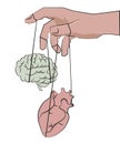 Managing the irrational heart and rational mind. The hand controls the heart and brain like puppets Royalty Free Stock Photo