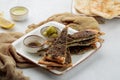 Manakish Zaatar Cheese pizza slice with lime and olive served in dish isolated on table top view of arabian food Royalty Free Stock Photo