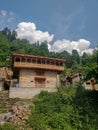 Manali, India - June 10th 2019: Beautiful architecture of traditional Indian Himalayan mountain village temple.
