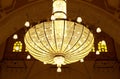 MANAMA, BAHRAIN - JUNE 26: A beautiful massive intricate chandelier hanging in the middle of the dome of Al Fateh Grand Mosque on