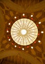 MANAMA, BAHRAIN - JUNE 26: A beautiful massive intricate chandelier hanging in the middle of the dome of Al Fateh Grand Mosque on