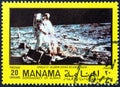 MANAMA DEPENDENCY - CIRCA 1970: A stamp printed in United Arab Emirates shows Aldrin and seismograph, circa 1970. Royalty Free Stock Photo