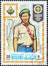 MANAMA DEPENDENCY - CIRCA 1971: A stamp printed in United Arab Emirates shows boy scout from Laos, circa 1971.