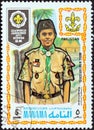 MANAMA DEPENDENCY - CIRCA 1971: A stamp printed in United Arab Emirates shows boy scout from Pakistan, circa 1971.