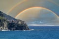 Manarola cinque terre pictoresque village with double rainbow sky background Royalty Free Stock Photo