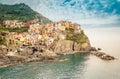 Manarola, Cinque Terre - romantic village with colorful houses on cliff over sea in Cinque Terre National Park Royalty Free Stock Photo