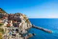 Manarola, Italy. August 22, 2020: Cinque Terre in Liguria in Italy. Aerial view of colorful houses and the blue sea in the