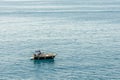 Tourist boat off the coast at Manarola Liguria Italy on April 20, 2019. Three unidentified