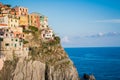 Manarola village hangs on cliff of Cinque Terre in Italy