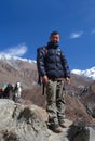 Smiling Sherpa trekking guide walking to the pass in Tsum valley, Nepal Himalayas