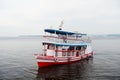 Manaus, Brazil - December 04, 2015: pleasure boat float along sea coast. Holiday cruiser ship on seascape. Summer vacation and tra Royalty Free Stock Photo