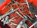 Manby kinds of mechanic`s handy tools in the old dirty box for a
