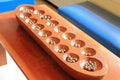Mancala or sowing or count and capture game Royalty Free Stock Photo