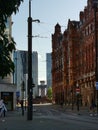 Manchester City Street scene with Victorian buildings set against modern towers