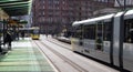 Metrolink Tram at St Peters Square Station.  Public Transport Vehicle.  People in shot Royalty Free Stock Photo