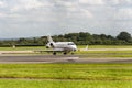 MANCHESTER UK, AUGUST 20 2020: NetJets Europe Bombardier Challenger 350 is documented taxying on the airport taxiways after Royalty Free Stock Photo