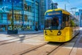 Light rail Metrolink tram in the city center of Manchester in the UK Royalty Free Stock Photo