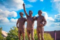 The United Trinity bronze sculpture at Old Trafford Stadium in Manchester, UK