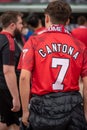Manchester united fan with Cantona in the back Royalty Free Stock Photo