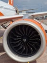 Front view of the engine of an EasyJet A320nx aircraft at Manchester Airport. EasyJet is a British low-cost airline carrier