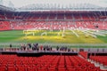 Manchester United`s Old Trafford stadium. Seating is empty and the pitch is having light treatment to help maintain the grass