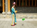 Manchurian girl juggling diabolo Royalty Free Stock Photo