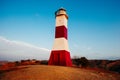 Mancora, Piura, Peru - April 2019 Mancora lighthouse over the mountain on a cloudy sunset