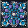 Mandala dot art painting on wood tiles. Beautiful mandala hand painted by colorful dots on black wood. National patterns Royalty Free Stock Photo
