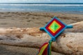 Mandala Eye of God Mexican Huichol Crafts on trunk in Sayulita beach. Royalty Free Stock Photo
