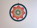 Mandala made of crochet , colored.