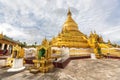 Kuthodaw Pagoda, golden yellow Buddhist religious structure in the Mandalay, Burma