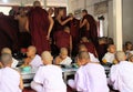 MANDALAY, MYANMAR - DECEMBER 18. 2015: Buddhist monks having breakfast at Mahagandayon Monastery