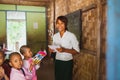 Mandalay, Myanmar (Burma), 2016: young girls attend to school in Mandalay