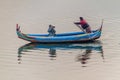 MANDALAY, MYANMAR - DECEMBER 4, 2016: Boat with a photographer on Taungthaman lake in Amarapura near Mandalay, Myanm