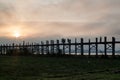 MANDALAY, MYANMAR - DECEMBER 4, 2016: People are crossing U Bein bridge over Taungthaman lake in Amarapura near Mandalay, Myanm Royalty Free Stock Photo