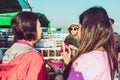 MANDALAY-Myanmar, January 20, 2019 : Female tourist guide paints tanaka powder on female tourist face while traveling on boat on