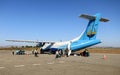 MANDALAY, MYANMAR - JANUARY 10. 2016: Passengers boarding small propeller plane on runway for departure to Ngapali Beach