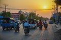 Mandalay, Myanmar - March 26, 2017: Beautiful sunset and evening traffic on the roads of Mandalay